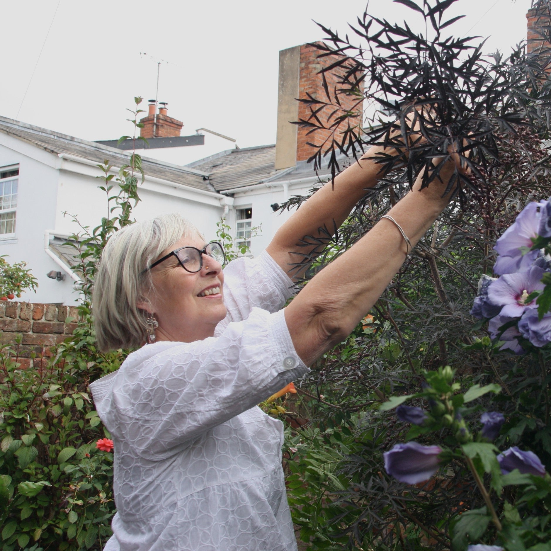 Sue Brown collecting garden folliage